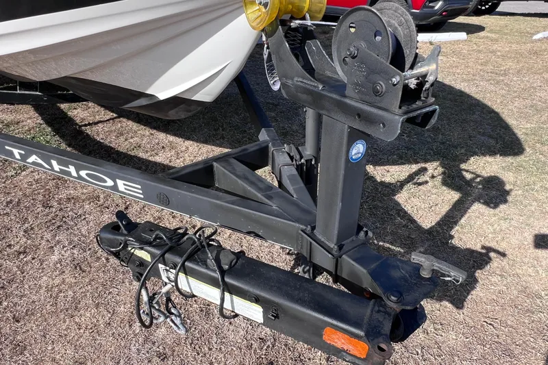 Slide: The Image of Trailer hitch of a 2019 Tahoe 450 TS boat on grass. - 5