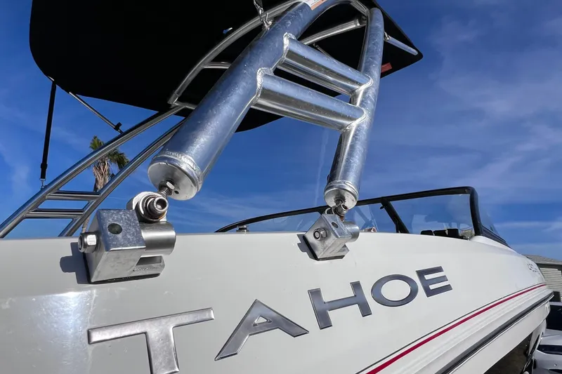 Slide: The Image of 2019 Tahoe 450 TS boat with metal ladder against blue sky background. - 7