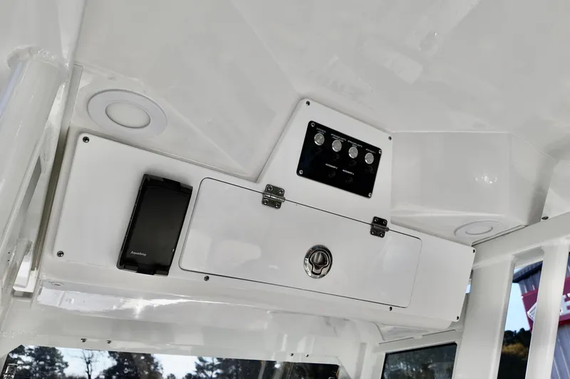 Slide: The Image of 2026 Sea Fox 268 Commander boat console with storage and control panel. - 11