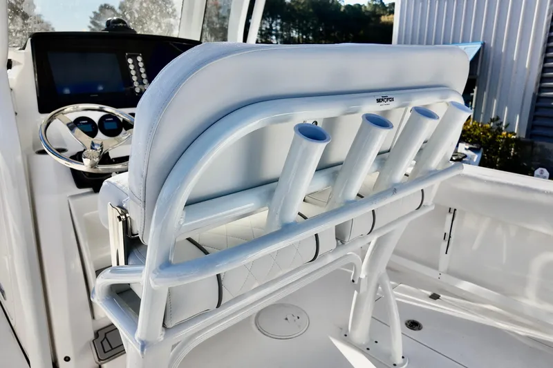 Slide: The Image of 2026 Sea Fox 268 Commander boat interior with rod holders and steering console. - 13
