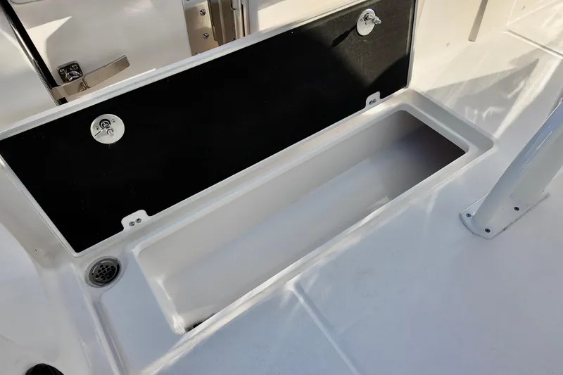 Slide: The Image of 2026 Sea Fox 268 Commander storage compartment with open lid on deck. - 15