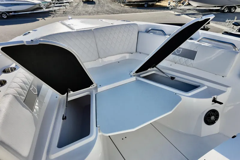 Slide: The Image of 2026 Sea Fox 268 Commander boat interior with open storage compartments and cushioned seating. - 20
