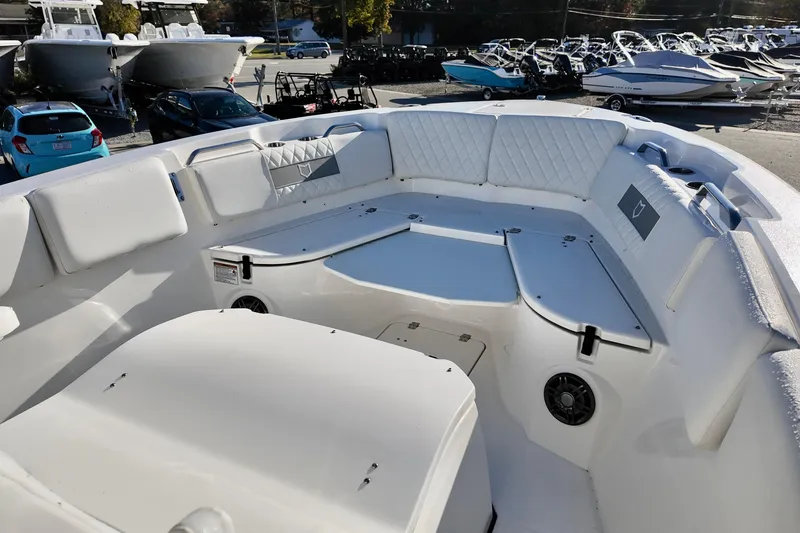 Slide: The Image of 2026 Sea Fox 268 Commander boat interior with cushioned seating and storage compartments. - 21