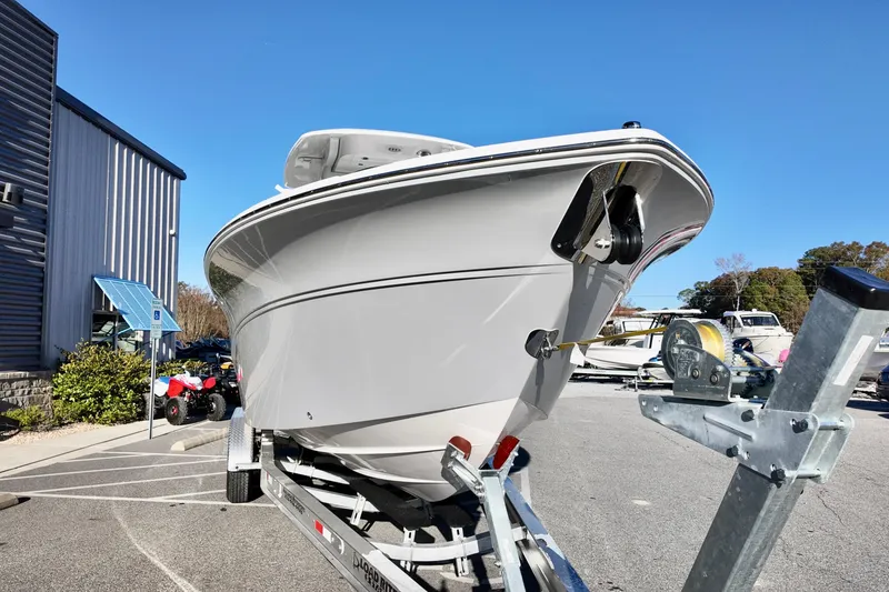 Slide: The Image of 2026 Sea Fox 268 Commander boat on trailer, parked outdoors under clear blue sky. - 3