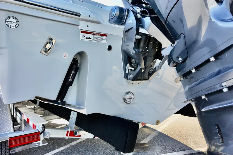 Slide: The Image of 2026 Sea Fox 268 Commander boat engine and transom detail on trailer. - 4