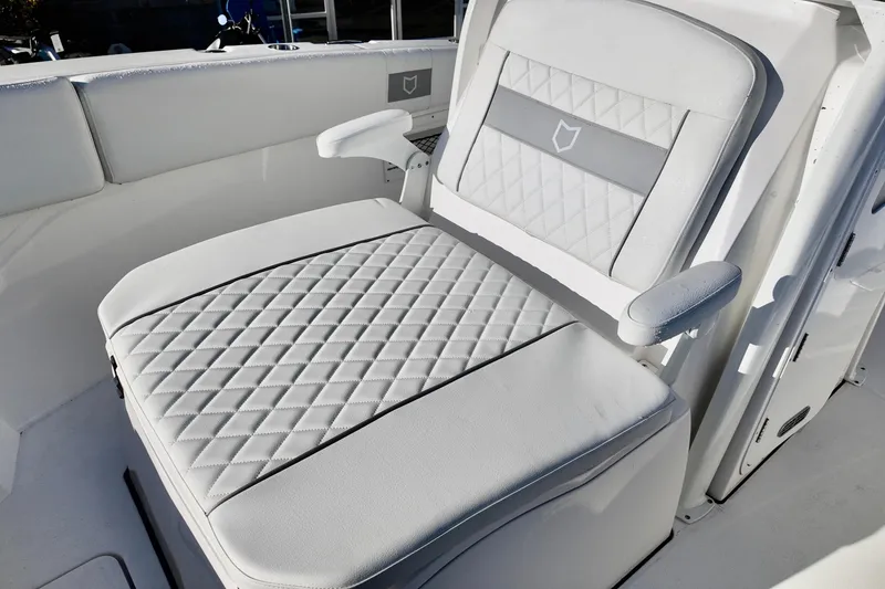 Slide: The Image of 2026 Sea Fox 268 Commander boat seat with diamond-pattern upholstery. - 7