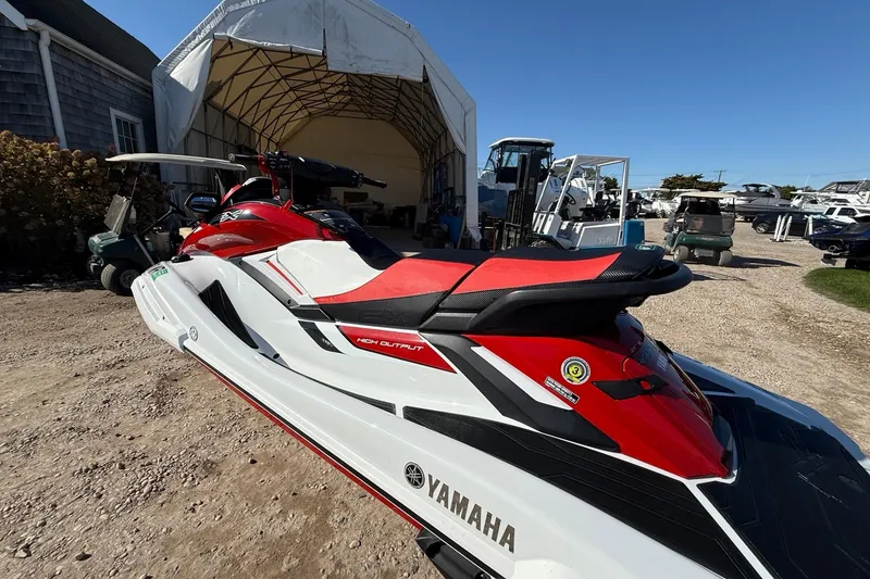 Slide: The Image of 2021 Yamaha WaveRunner FX Cruiser HO in a boatyard, showcasing sleek design and vibrant colors. - 4