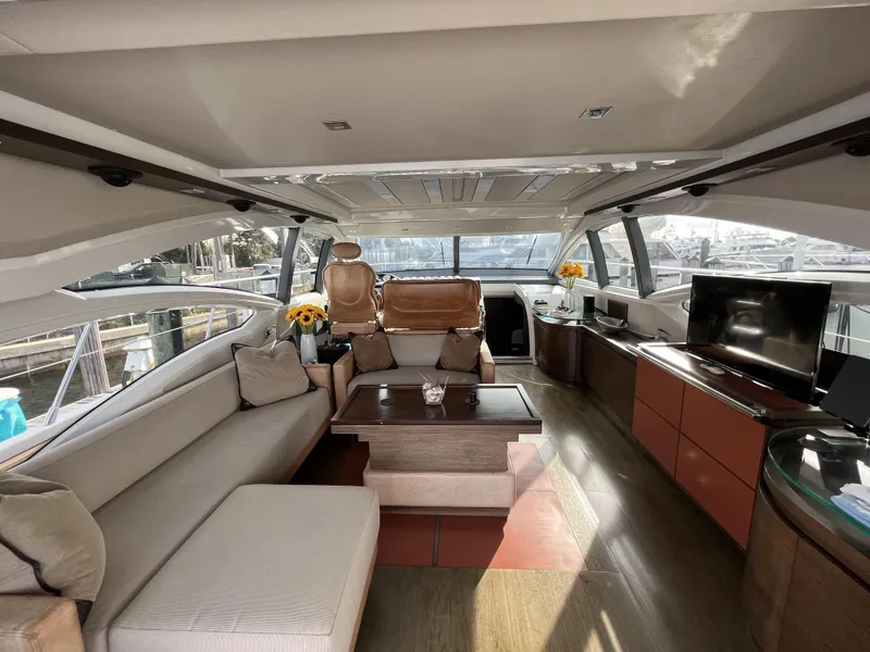 Slide: The Image of Luxurious interior of a 2008 Azimut 62S yacht with modern furnishings and panoramic windows. - 14