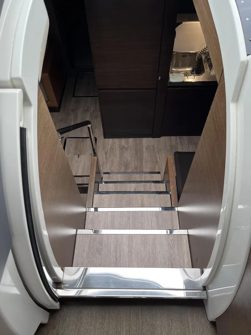 Slide: The Image of Staircase inside 2008 Azimut 62S yacht, featuring modern wood and metal design. - 19