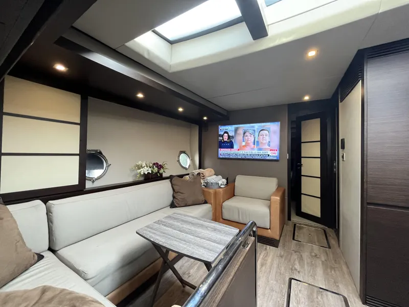 Slide: The Image of Luxurious interior of 2008 Azimut 62S yacht with modern seating and TV. - 20