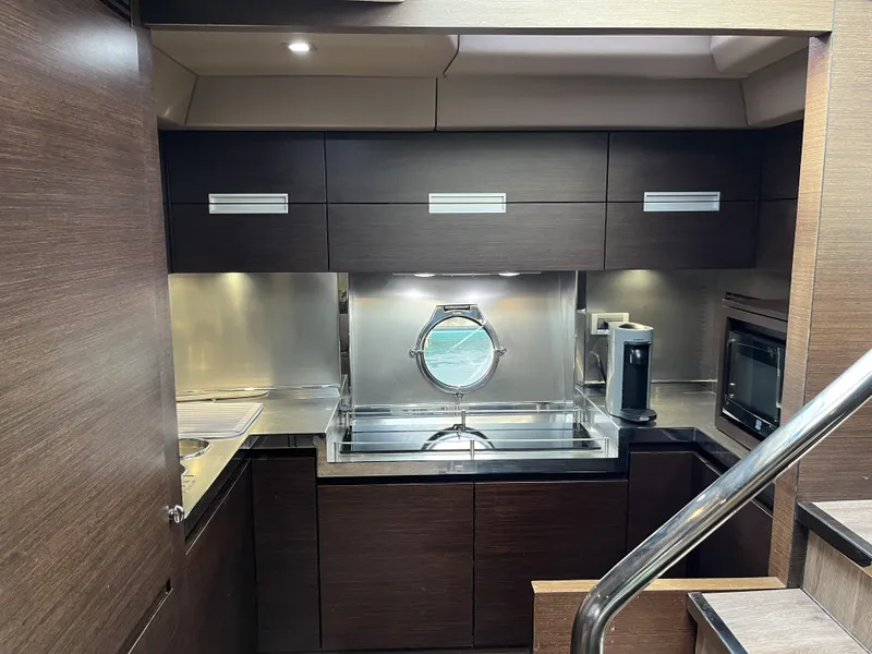 Slide: The Image of Luxurious kitchen interior of 2008 Azimut 62S yacht with modern appliances and sleek design. - 26