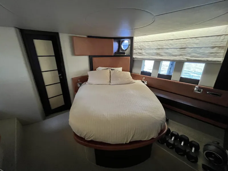 Slide: The Image of Luxurious bedroom interior of 2008 Azimut 62S yacht with modern design and large windows. - 28
