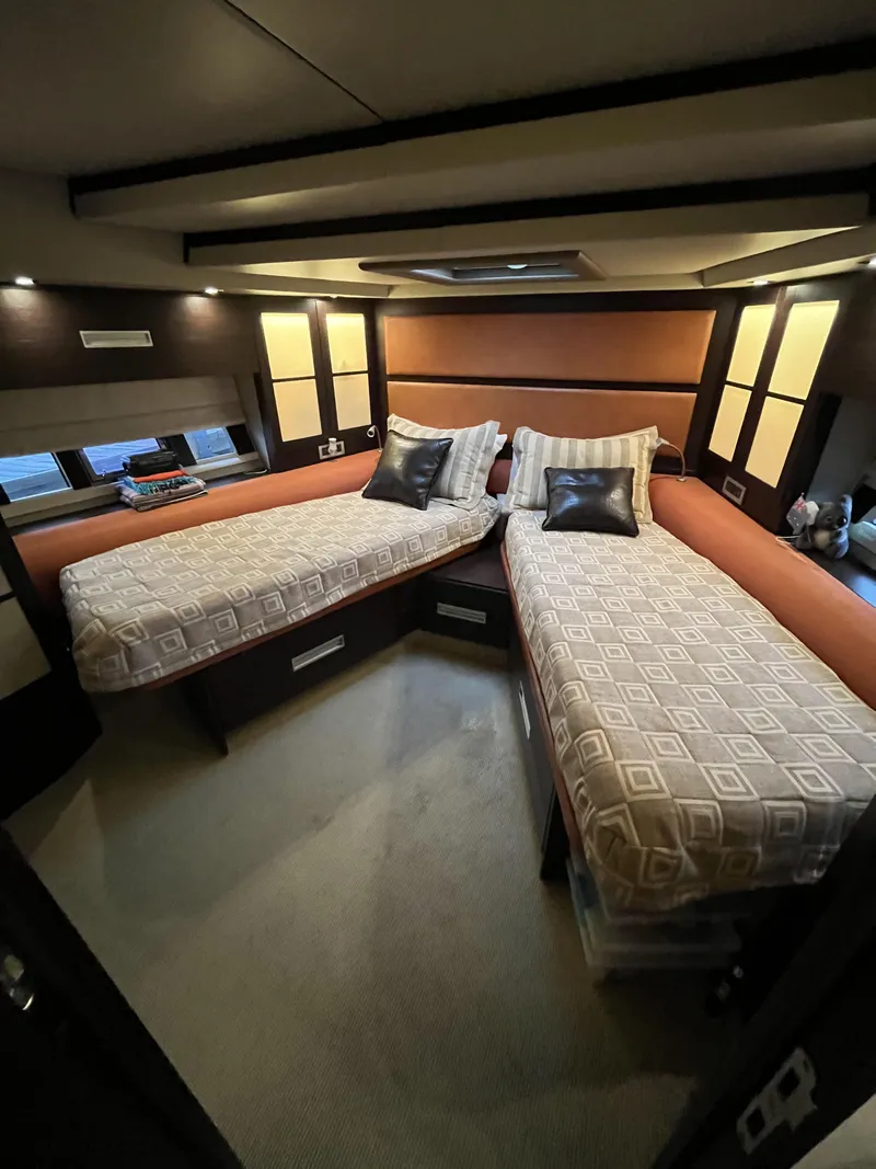 Slide: The Image of Luxurious bedroom interior of a 2008 Azimut 62S yacht with twin beds and modern decor. - 36