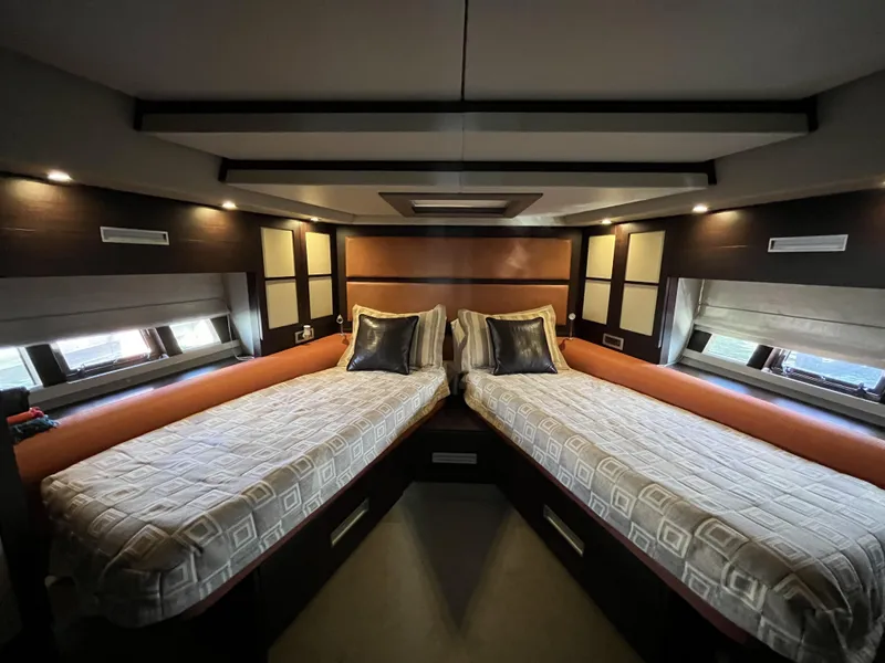 Slide: The Image of Luxurious twin cabin interior of 2008 Azimut 62S yacht, featuring modern design and cozy bedding. - 37
