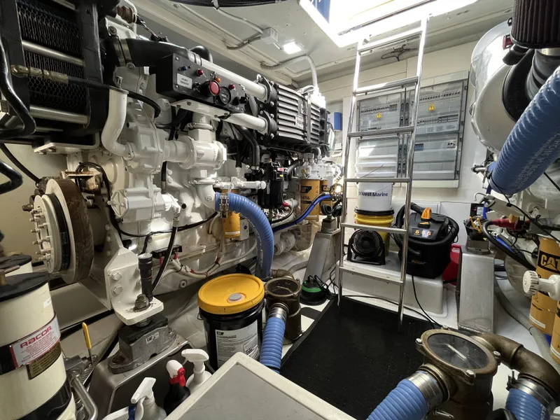 Slide: The Image of Engine room of a 2008 Azimut 62S yacht, featuring complex machinery and equipment. - 43