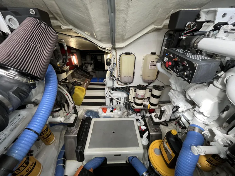 Slide: The Image of Engine room of a 2008 Azimut 62S yacht, showcasing mechanical components and equipment. - 44
