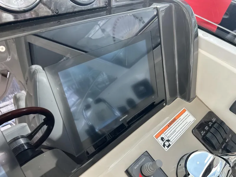 Slide: The Image of Control panel of a 2008 Sea Ray 480 Sundancer yacht with navigation display. - 13