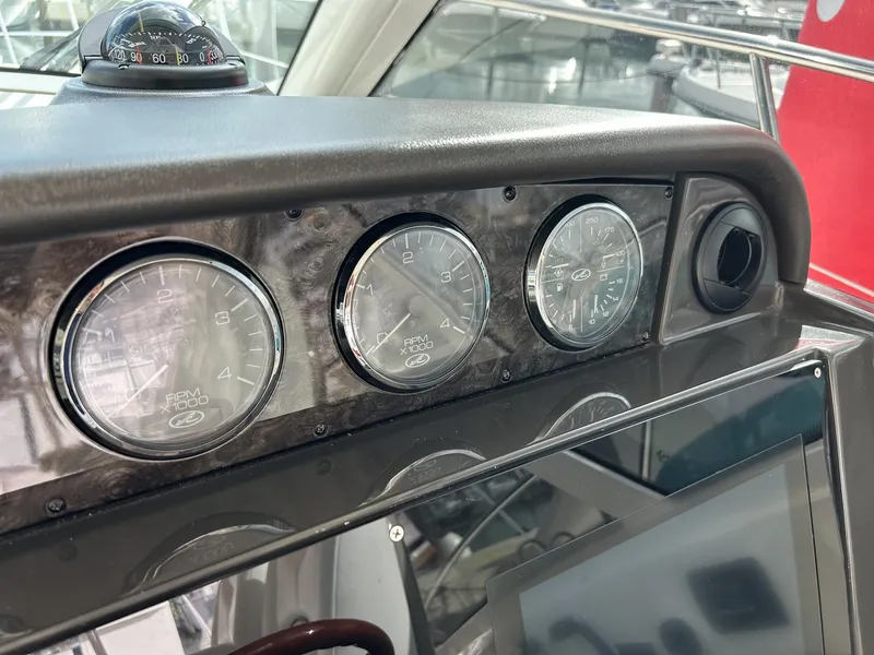 Slide: The Image of Dashboard of 2008 Sea Ray 480 Sundancer with gauges and compass. - 14