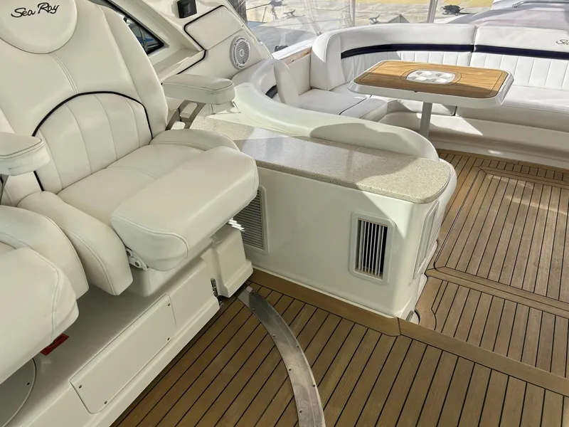 Slide: The Image of Luxurious interior of 2008 Sea Ray 480 Sundancer yacht with plush seating and wooden flooring. - 19