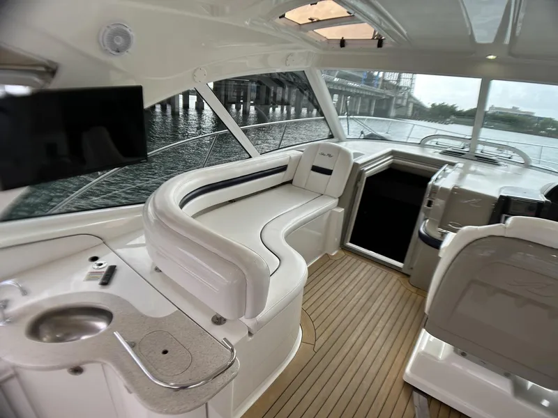 Slide: The Image of Interior of 2008 Sea Ray 480 Sundancer yacht with elegant seating and modern amenities. - 23