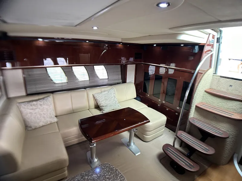 Slide: The Image of Luxurious interior of 2008 Sea Ray 480 Sundancer yacht with elegant seating and wooden accents. - 34