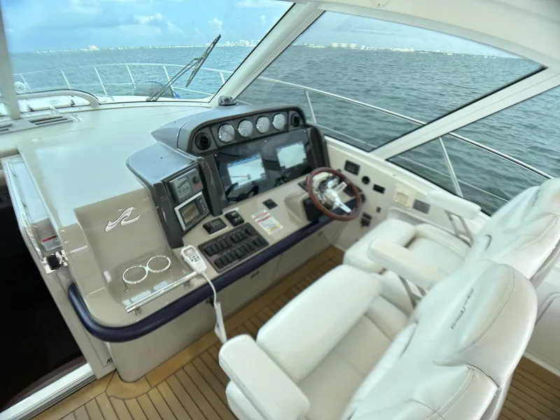 Slide: The Image of 2008 Sea Ray 480 Sundancer helm with modern controls and ocean view. - 45