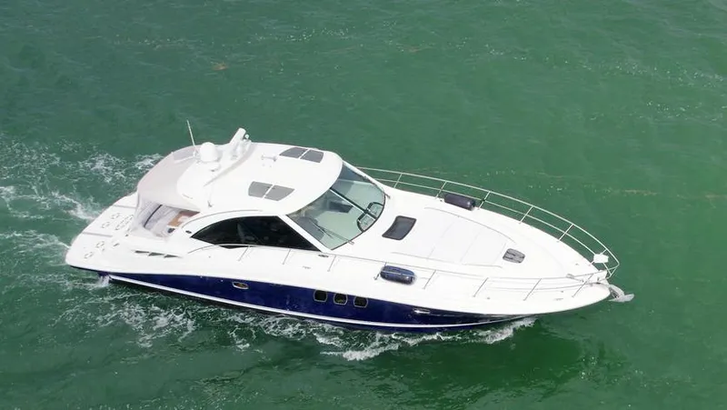 Slide: The Image of 2008 Sea Ray 480 Sundancer yacht cruising on green water. - 5
