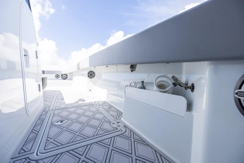 Slide: The Image of 2023 Freeman 47 boat deck with modern design and built-in speakers. - 102