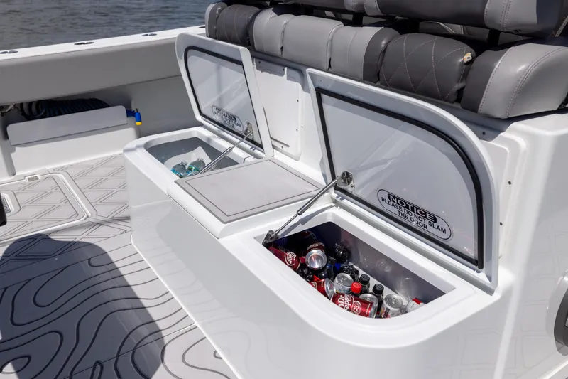 Slide: The Image of Freeman 47 boat with open storage compartments, stocked with beverages, 2023 model. - 103