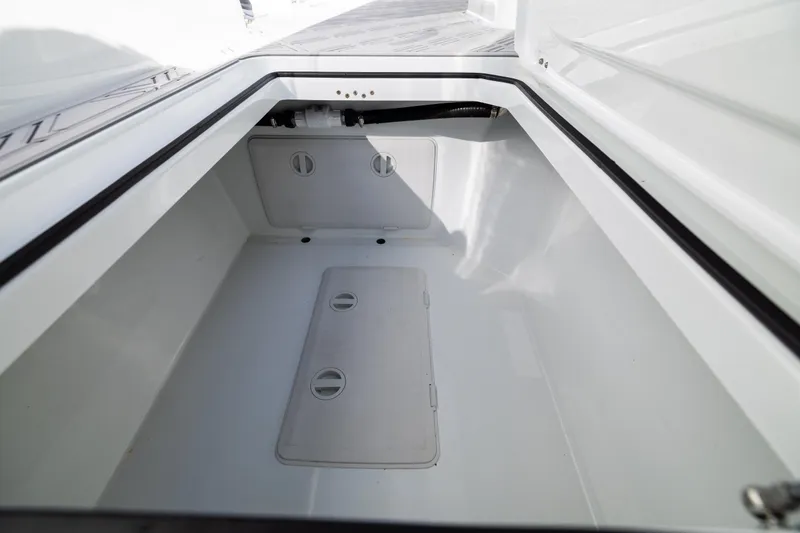 Slide: The Image of Storage compartment of 2023 Freeman 47 boat, featuring a spacious, clean interior design. - 114