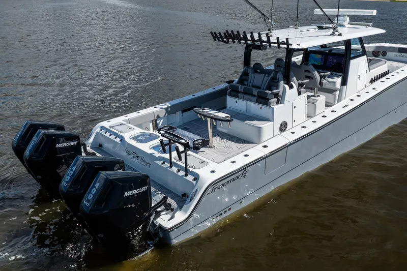 Slide: The Image of 2023 Freeman 47 boat with Mercury engines on calm water. - 13