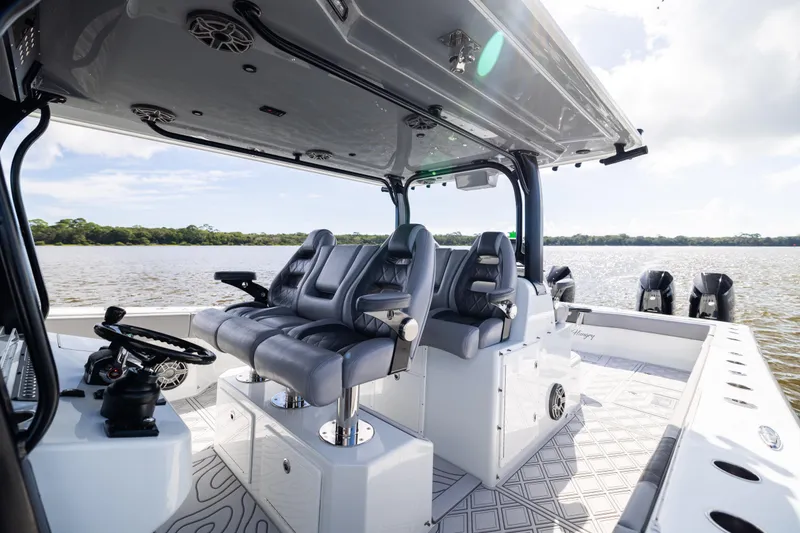 Slide: The Image of Luxury interior of 2023 Freeman 47 boat with plush seating and advanced controls. - 60