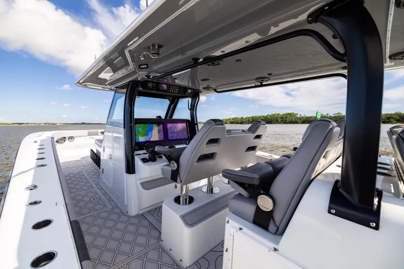 Slide: The Image of 2023 Freeman 47 boat interior with advanced navigation system and luxurious seating. - 63