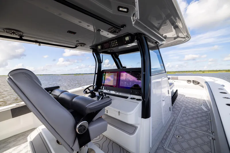 Slide: The Image of Interior view of 2023 Freeman 47 boat with modern helm and dual screens. - 67