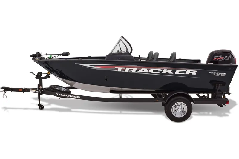 Slide: The Image of 2026 Tracker Pro Guide V-175 WT boat on trailer, parked outdoors under clear blue sky. - 4
