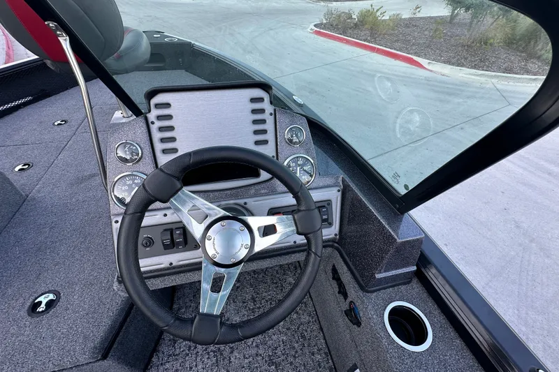 Slide: The Image of 2026 Ranger VS1682SC Angler boat dashboard with steering wheel and instrument panel. - 14