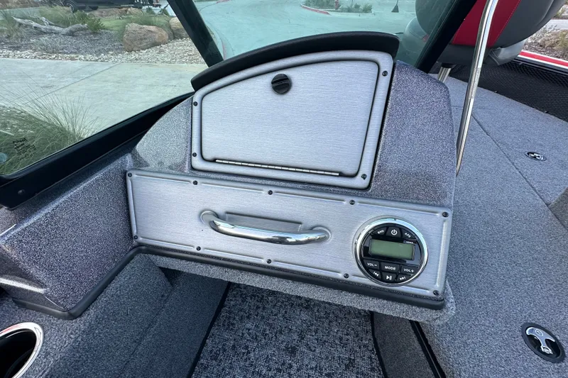 Slide: The Image of 2026 Ranger VS1682SC Angler boat dashboard with control panel and storage compartment. - 15