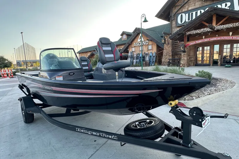 Slide: The Image of 2026 Ranger VS1682SC Angler boat on trailer outside outdoor store. - 1