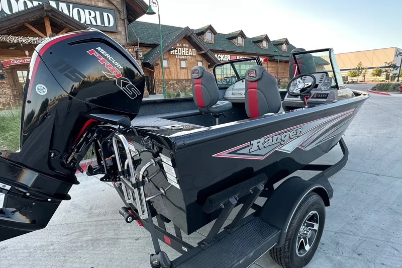 Slide: The Image of 2026 Ranger VS1682SC Angler boat with Mercury Pro XS engine, parked outside a store. - 6