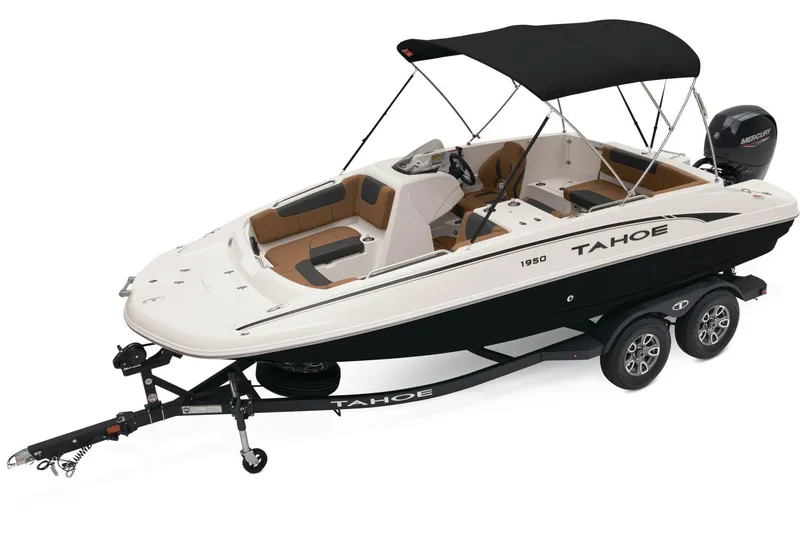 Slide: The Image of 2026 Tahoe 1950 boat on trailer with powerful outboard motor, parked outdoors. - 2
