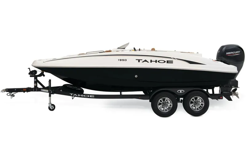Slide: The Image of 2026 Tahoe 1950 boat on trailer near Bass Pro Shops, featuring sleek design and powerful engine. - 3