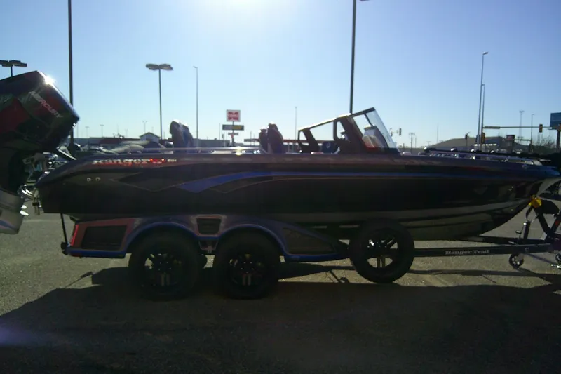 Slide: The Image of 2026 Ranger 621FS Pro boat on trailer in parking lot, side view. - 4