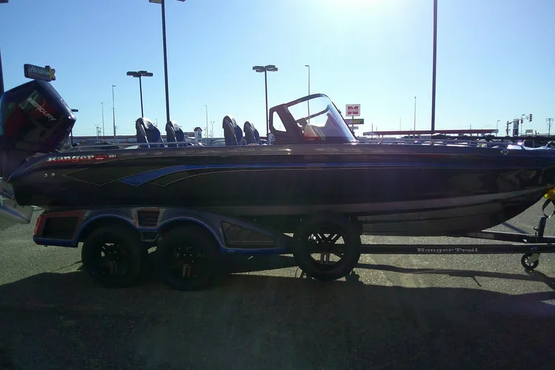 Slide: The Image of 2026 Ranger 621FS Pro boat on trailer in parking lot, side view. - 5