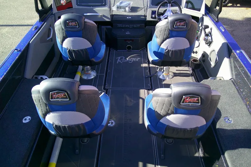 Slide: The Image of 2026 Ranger 621FS Pro boat interior with four cushioned seats and steering console. - 6