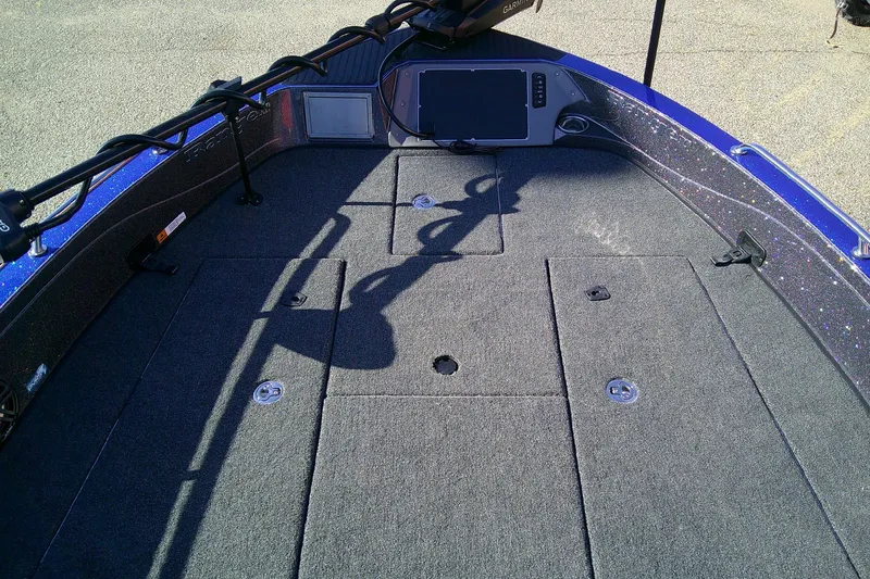 Slide: The Image of 2026 Ranger 621FS Pro boat deck with carpeted surface and storage compartments. - 8