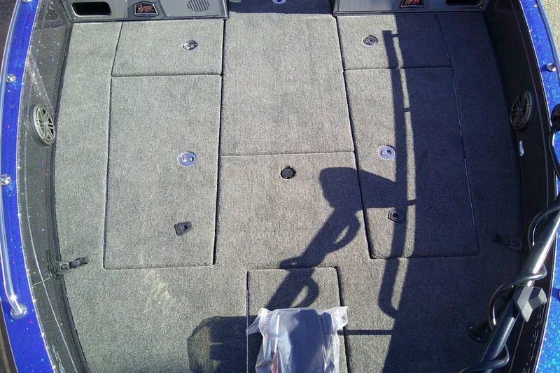 Slide: The Image of 2026 Ranger 621FS Pro boat deck with carpeted storage compartments. - 9