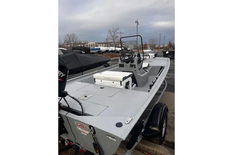 Slide: The Image of 2026 Tracker Bass Tracker Classic CC boat on trailer, parked outdoors. - 49