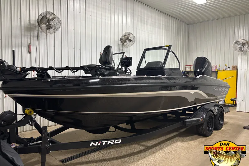The Image of 2026 Nitro ZV21 Pro boat in showroom, black exterior, on trailer at D&R Sports Center. - 0