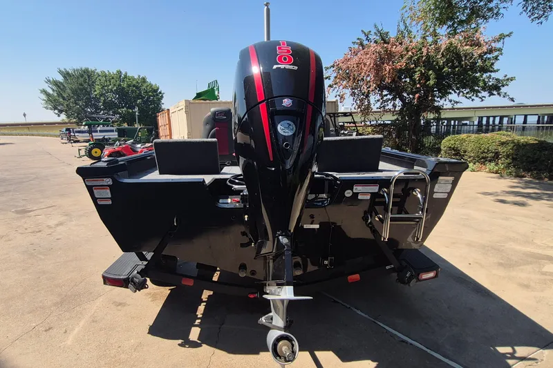 Slide: The Image of 2026 Ranger VS1782SC Reata boat with powerful outboard motor, parked outdoors. - 7