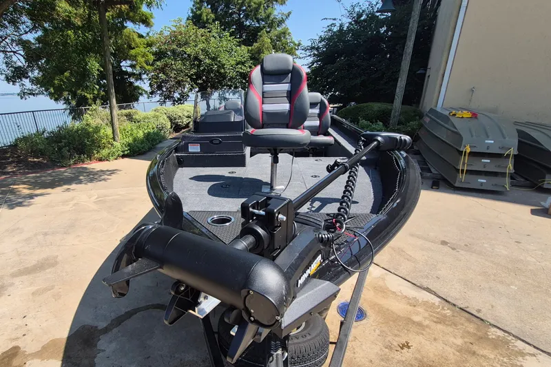 Slide: The Image of 2026 Ranger VS1782SC Reata boat with trolling motor and seating, parked outdoors. - 3